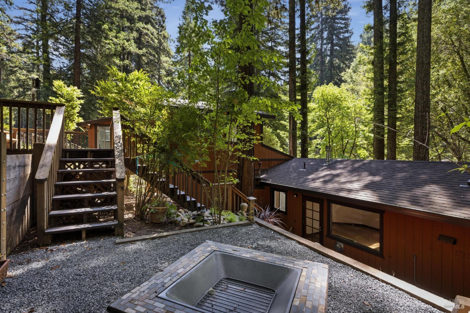 14911 Canyon 7 Road Guerneville, CA 95446 - Photo 28 of 32 a view of a chairs and tables in the backyard