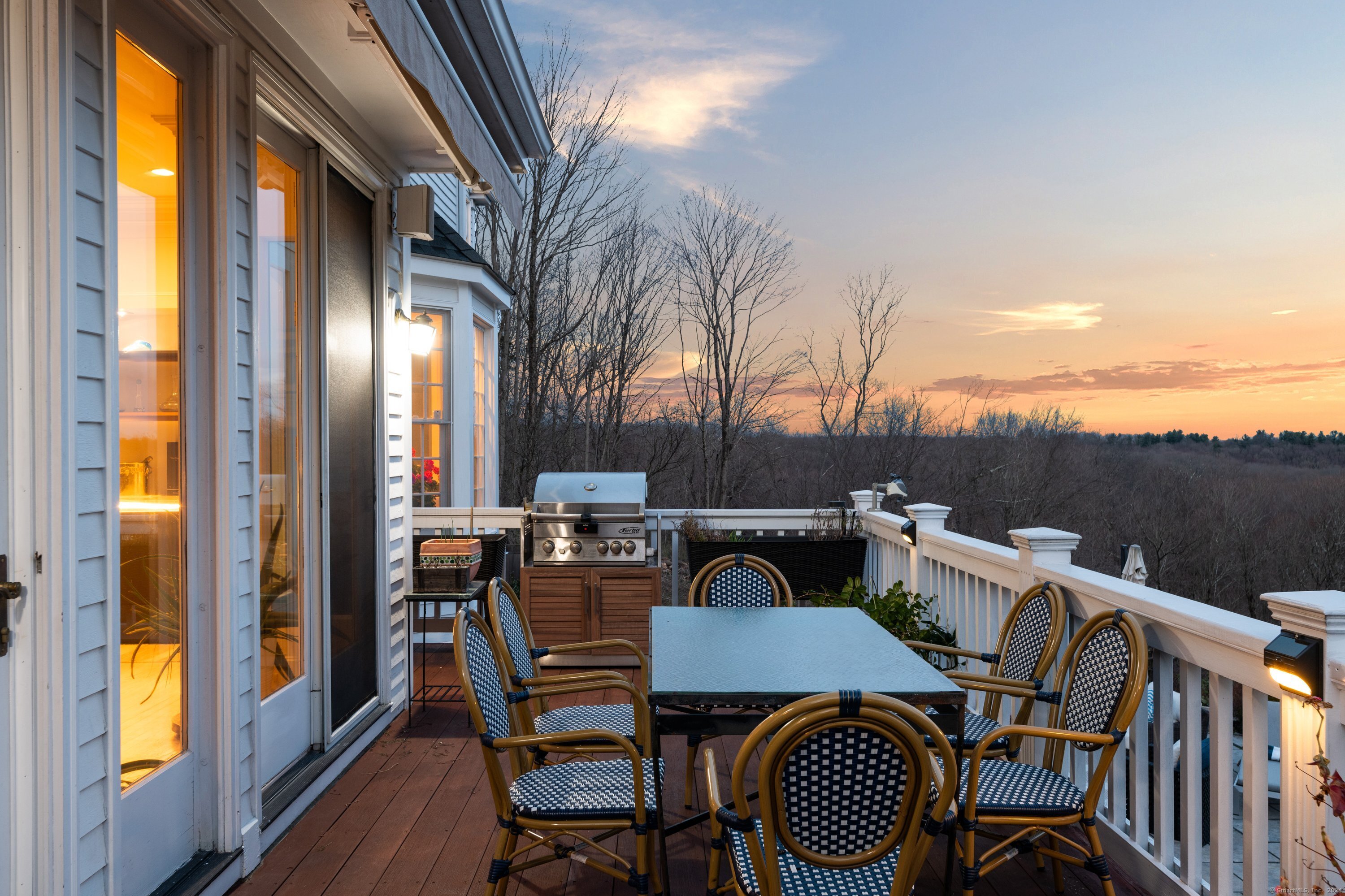 35 Branch Brook Road Wilton, CT 06897 - Photo 18 of 35 a view of a patio with table and chairs with wooden floor and fence
