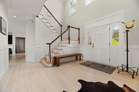 a view of a livingroom with furniture and staircase