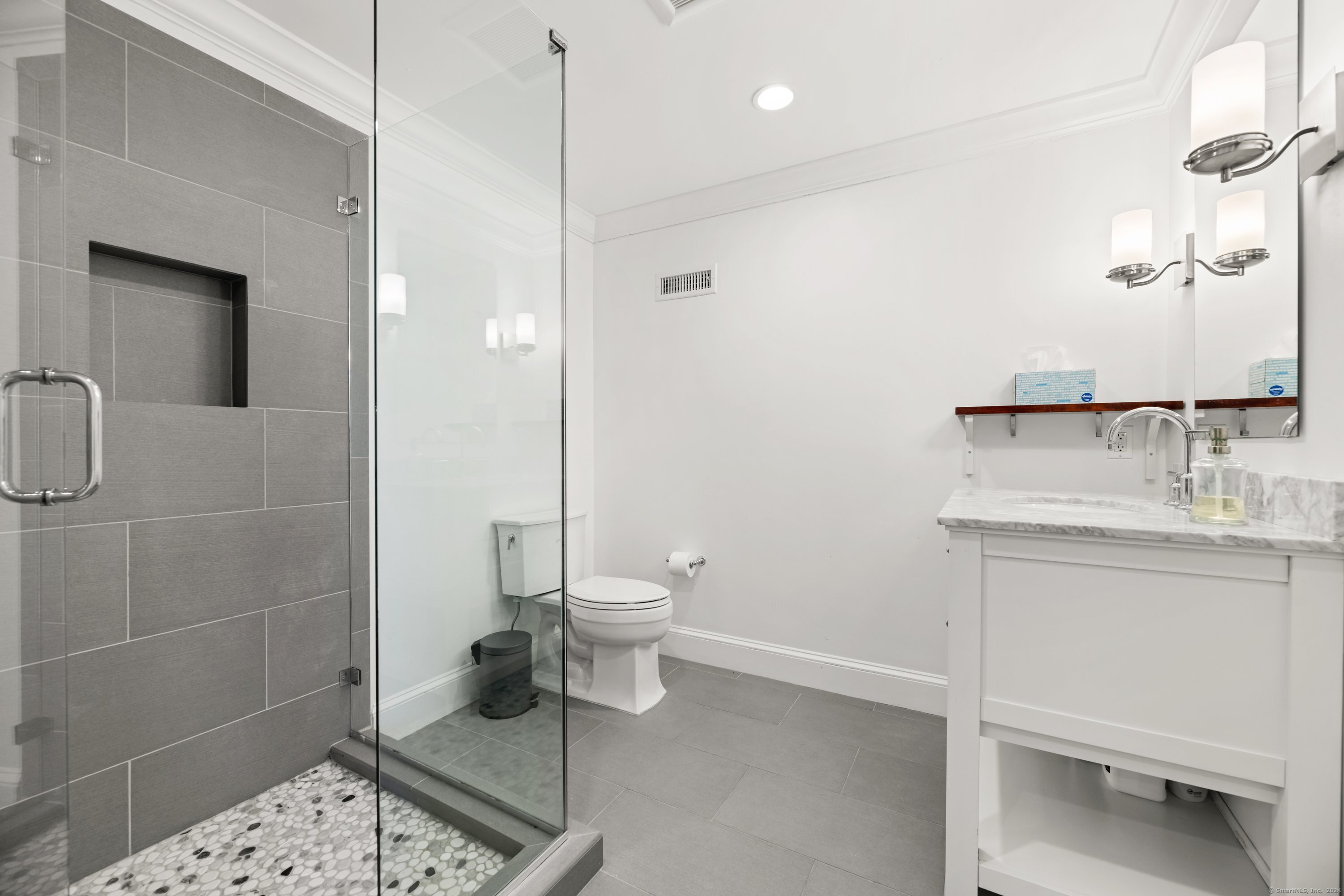 35 Branch Brook Road Wilton, CT 06897 - Photo 29 of 35 a bathroom with a toilet a sink and mirror