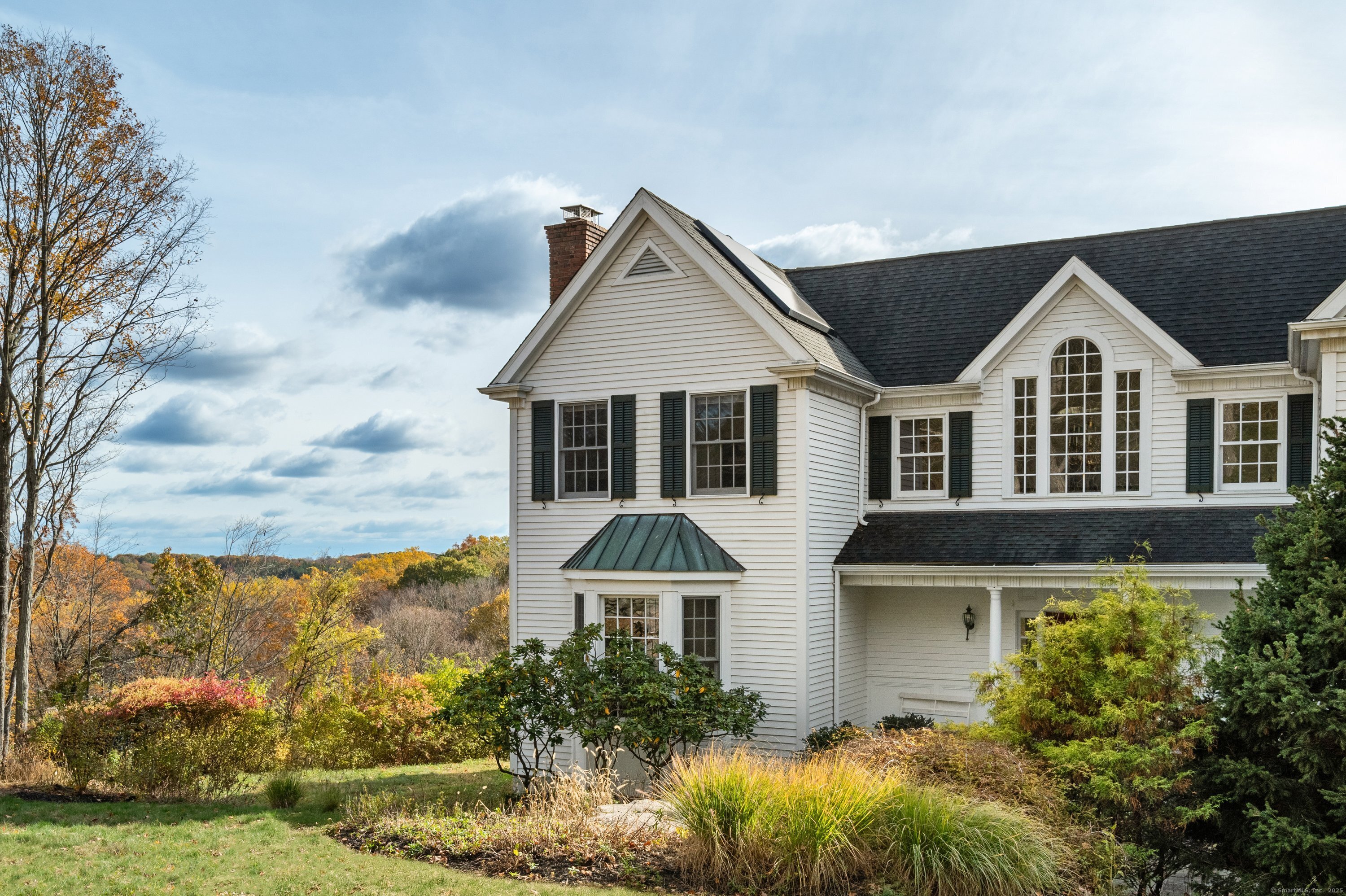 35 Branch Brook Road Wilton, CT 06897 - Photo 3 of 35 front view of house with a yard