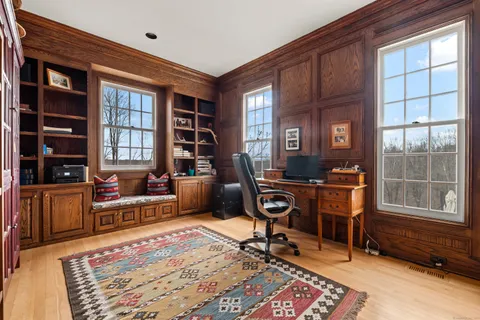a work room with furniture and windows