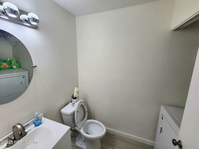 a bathroom with a toilet and a sink