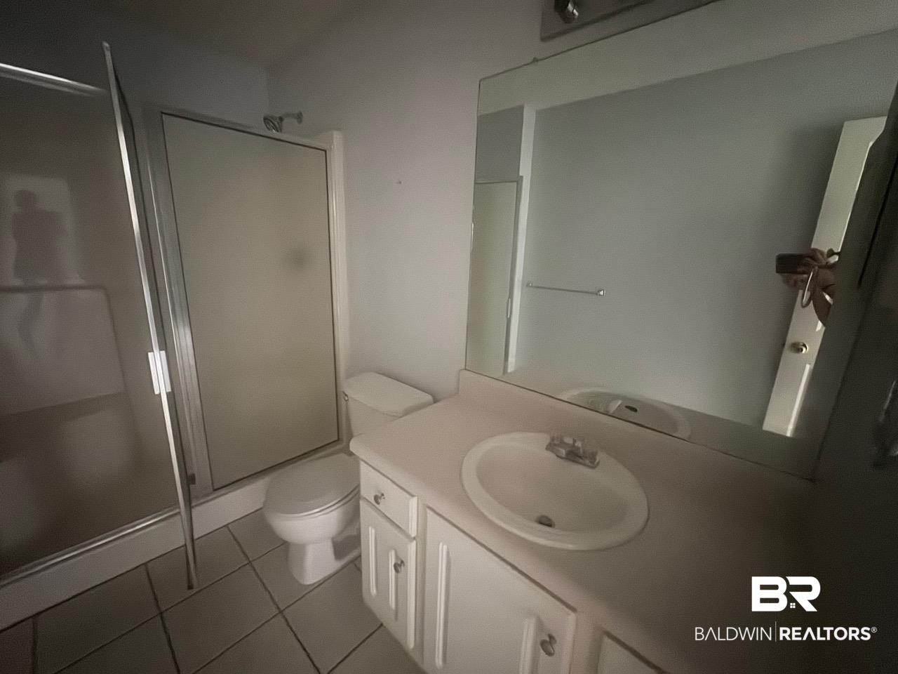 101 Monteith Circle Foley, AL 36535 - Photo 15 of 28 Full bath with a stall shower, vanity, and light tile patterned floors
