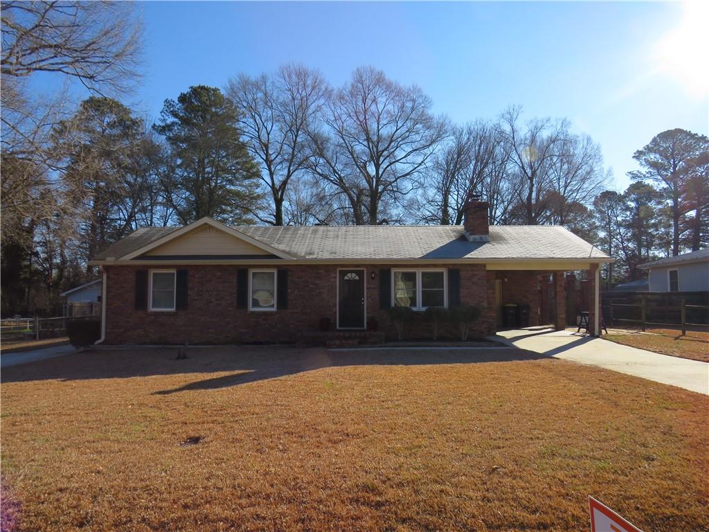 7 Gaddy Drive Southwest Rome, GA 30165 - Photo 1 of 1 a front view of a house with a yard and garage