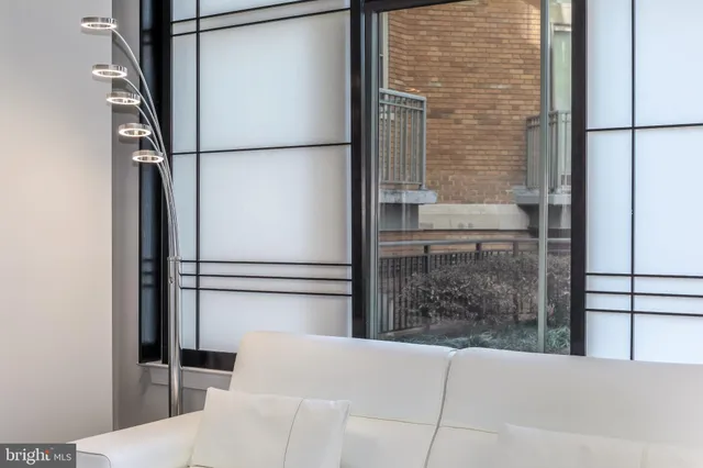 a bathroom with a shower and a glass door