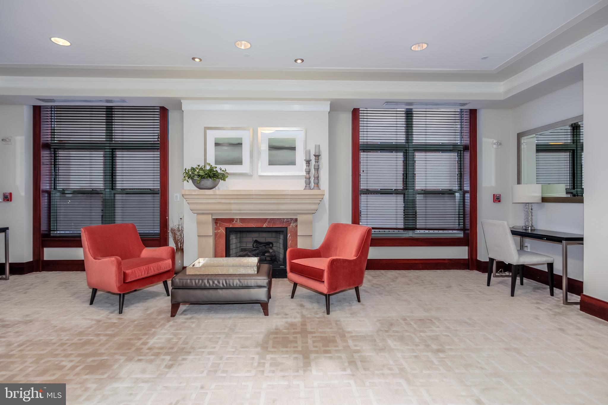 2425 L Street Northwest, Unit 211 Washington, DC 20037 - Photo 33 of 43 a living room with furniture and a fireplace