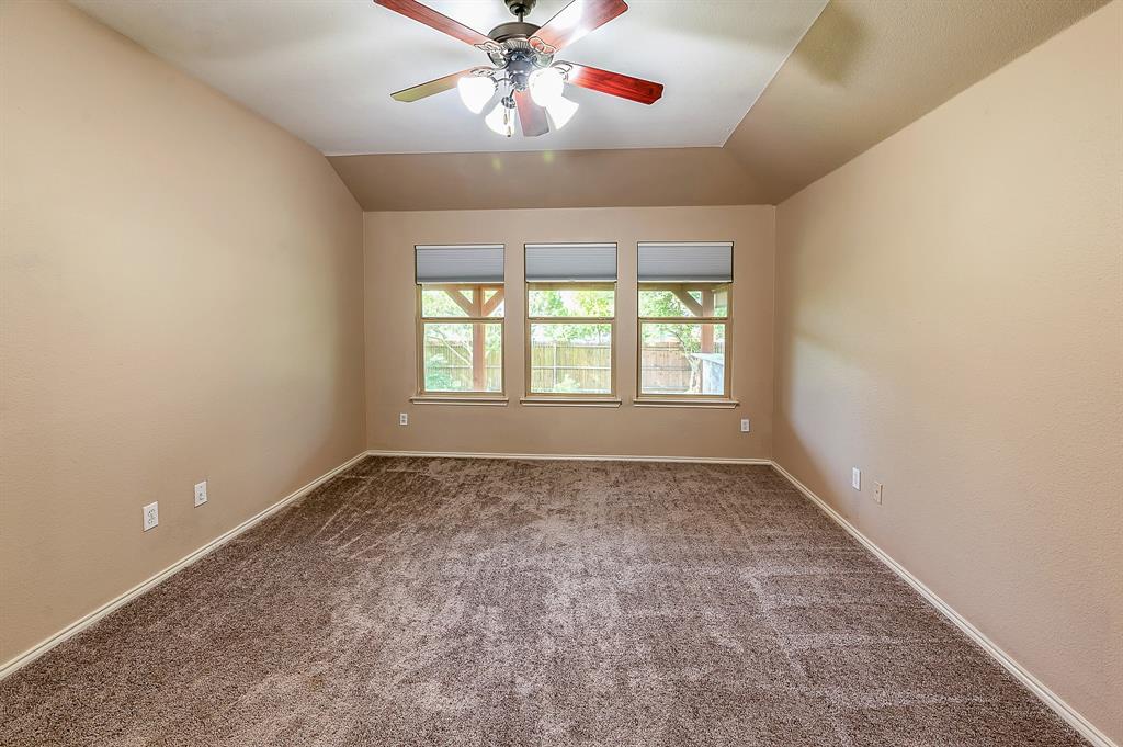 1070 Shepard Lane Lavon, TX 75166 - Photo 16 of 29 an empty room with chandelier fan and windows