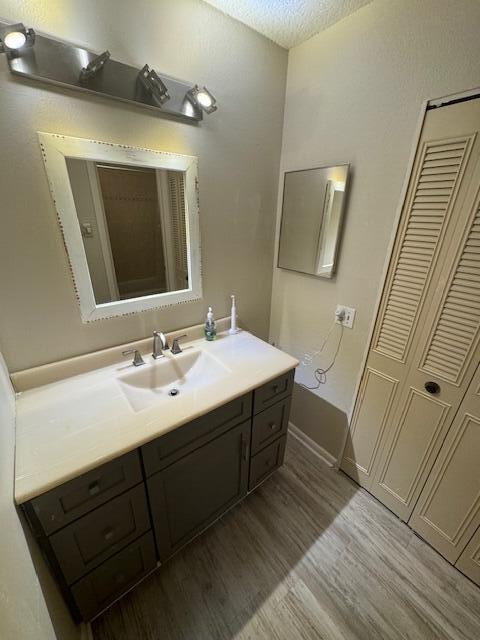 1465 Malibu Circle Northeast, Unit 101 Palm Bay, FL 32905 - Photo 17 of 25 a bathroom with a sink and mirror