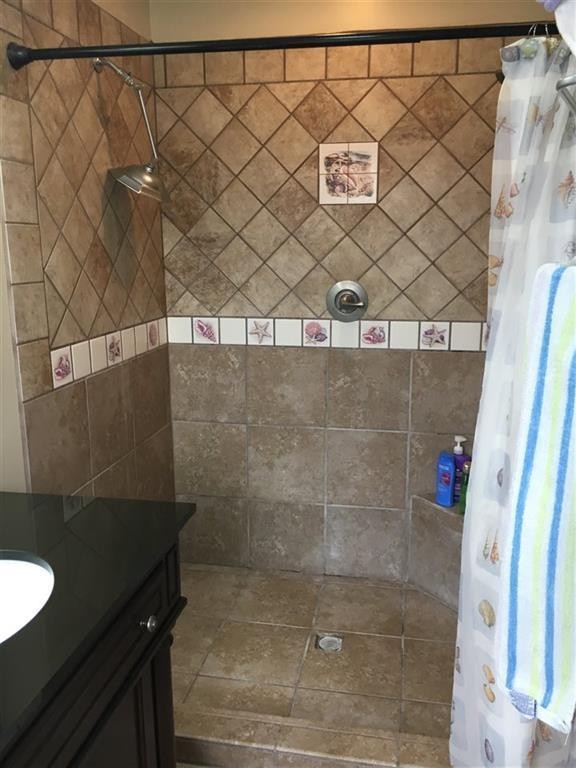 310 Highway 305 Decatur, TN 37322 - Photo 19 of 31 a bathroom with a granite countertop sink and a shower