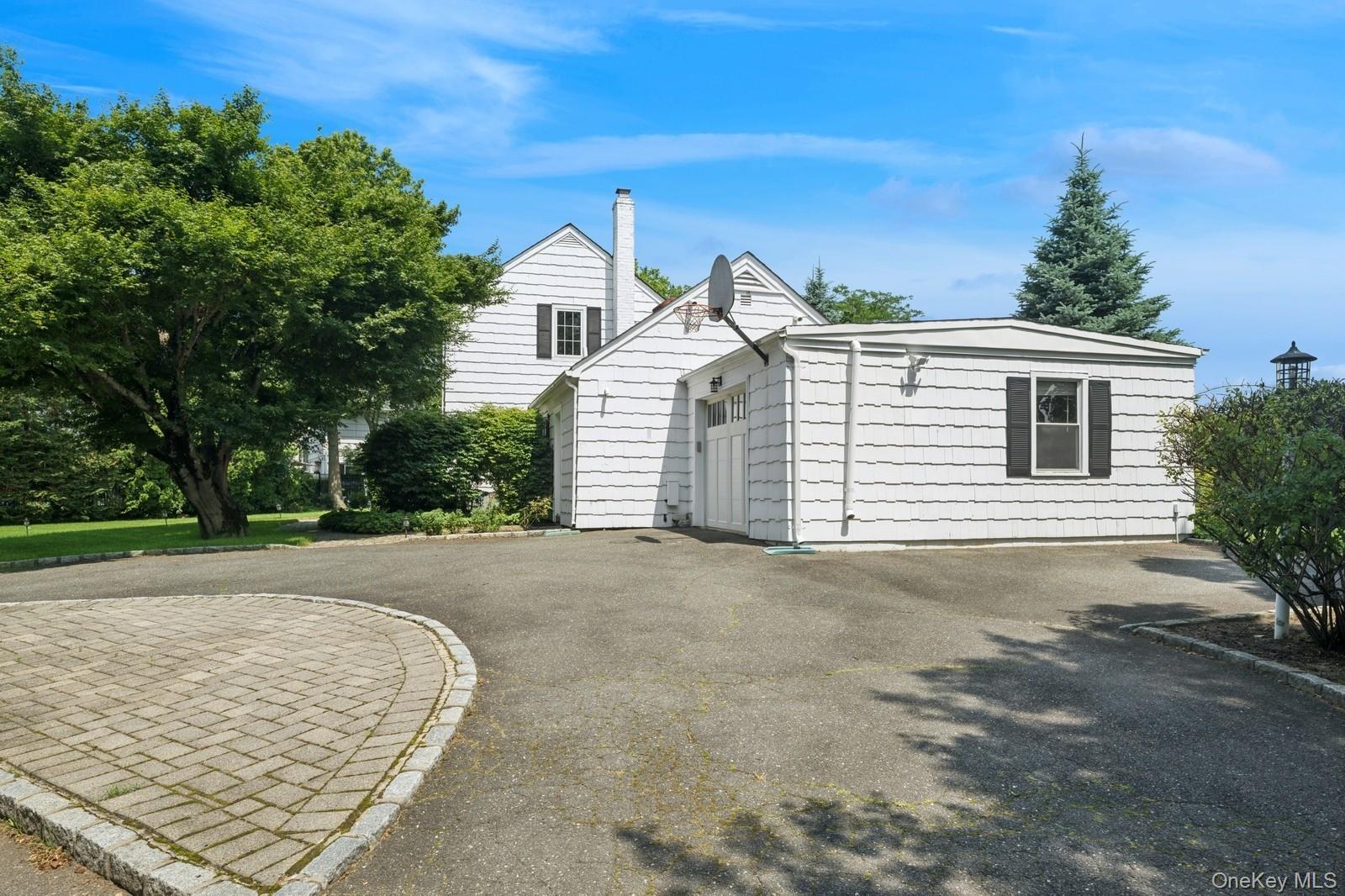 1250 Harbor Road Hewlett, NY 11557 - Photo 3 of 18 front view of a house with a yard