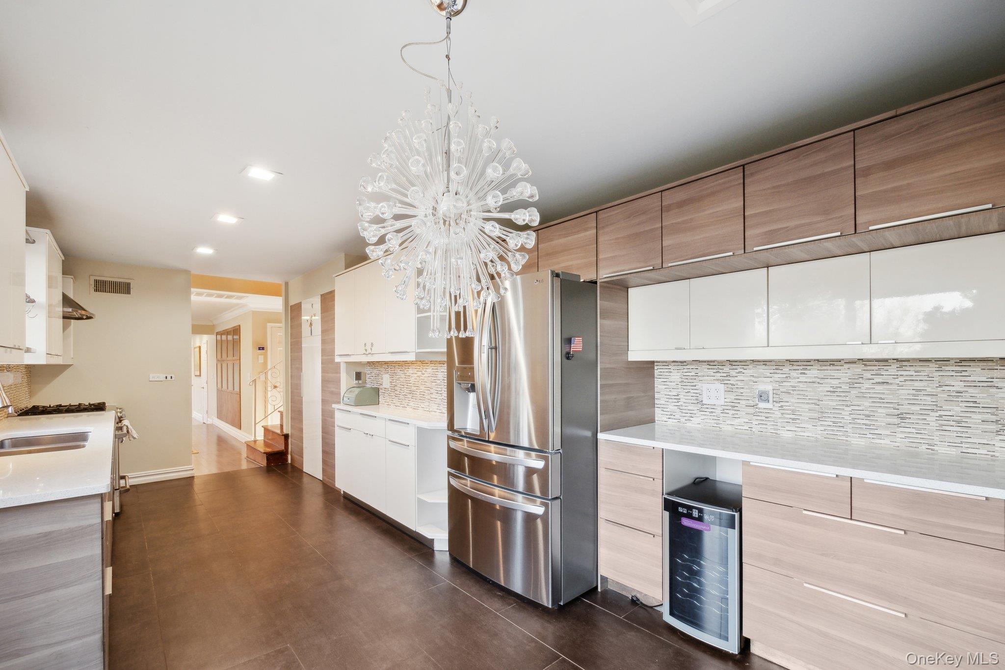 1250 Harbor Road Hewlett, NY 11557 - Photo 6 of 18 a open kitchen with stainless steel appliances granite countertop a refrigerator and a stove top oven