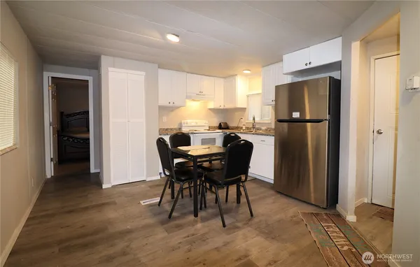 a view of a dining room with furniture