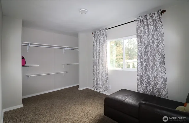 a room with a couch and a window