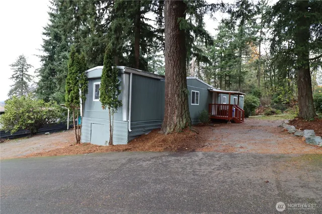 a view of a house with a yard and garage