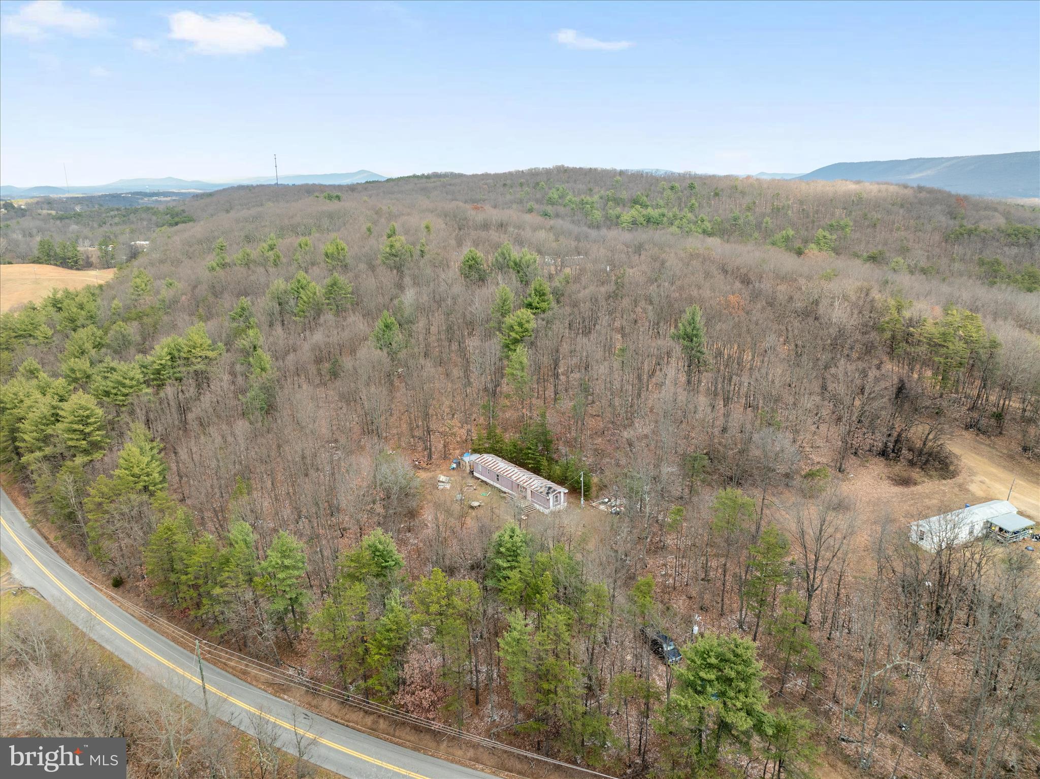 985 Waugh Road Berkeley Springs, WV 25411 - Photo 17 of 22 a view of a lake with mountain view