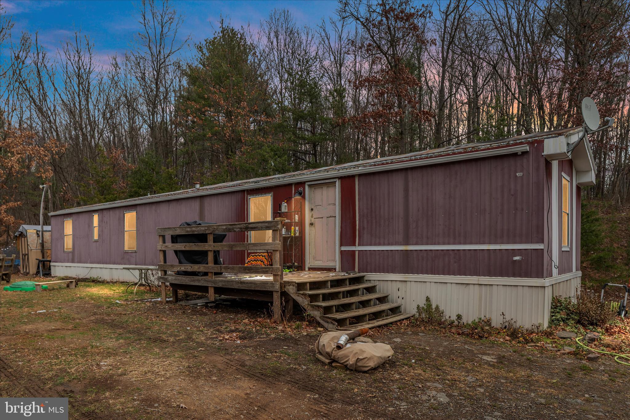 985 Waugh Road Berkeley Springs, WV 25411 - Photo 2 of 22 a house view with a backyard