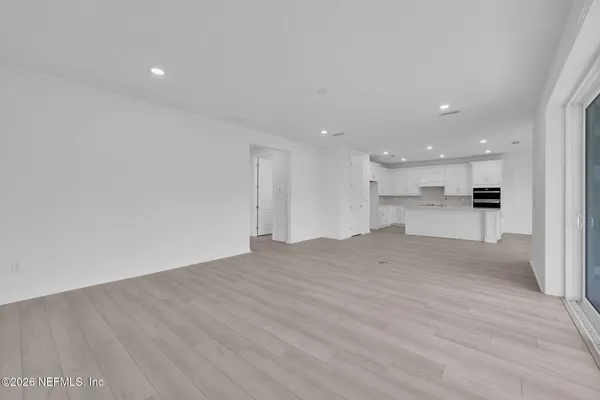 a bathroom with a tub a sink and shower