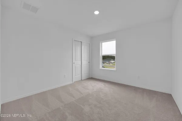 a view of an empty room with window