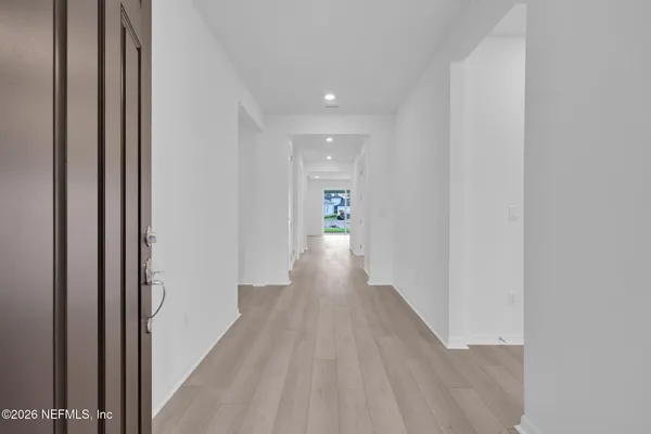 a kitchen with granite countertop sink stainless steel appliances and cabinets