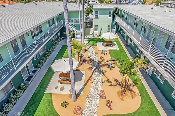 a view of an swimming pool with sitting area