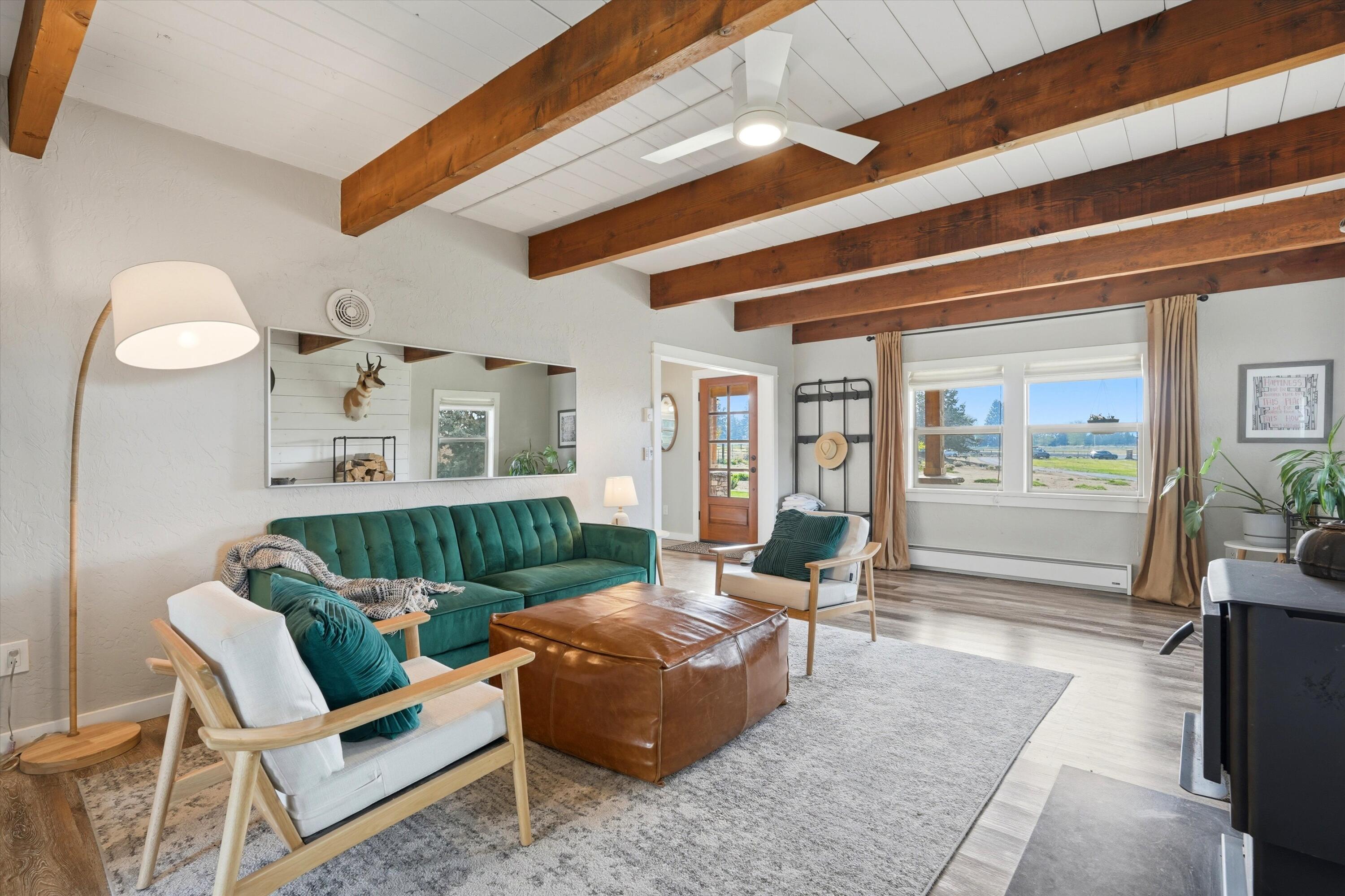 61280 Larsen Road Bend, OR 97702 - Photo 8 of 58 a living room with furniture and wooden floor