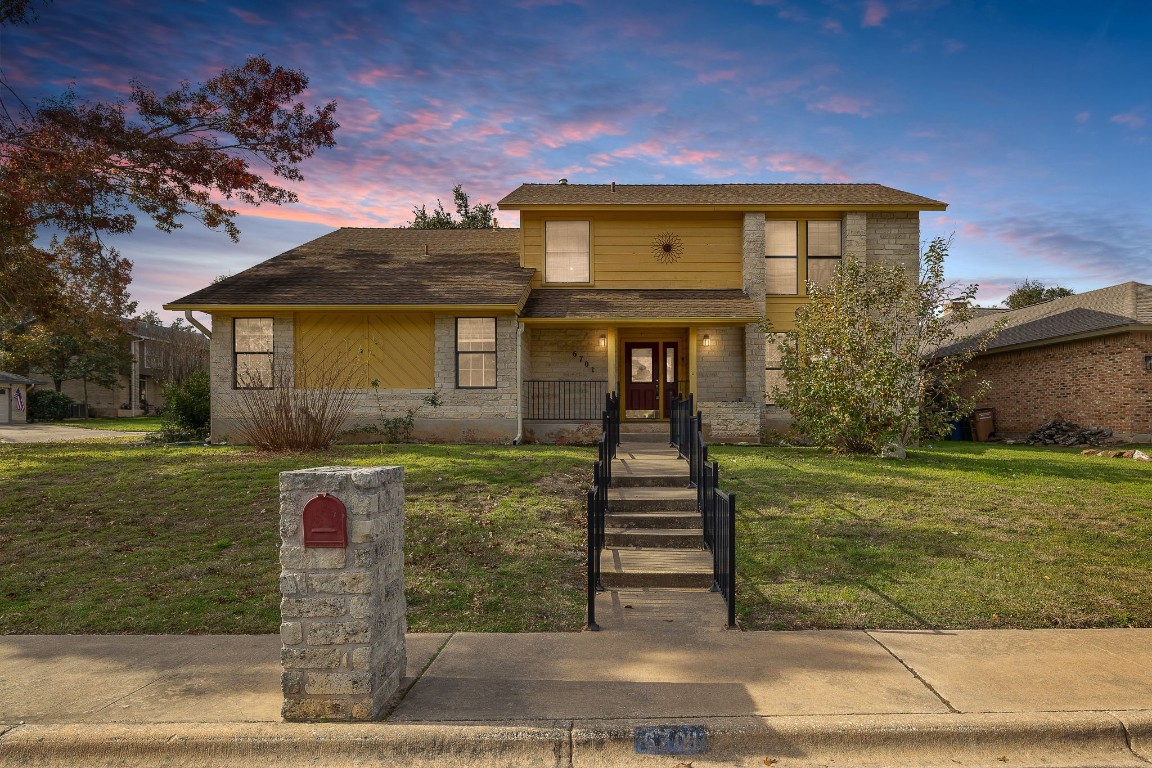 a front view of a house with garden