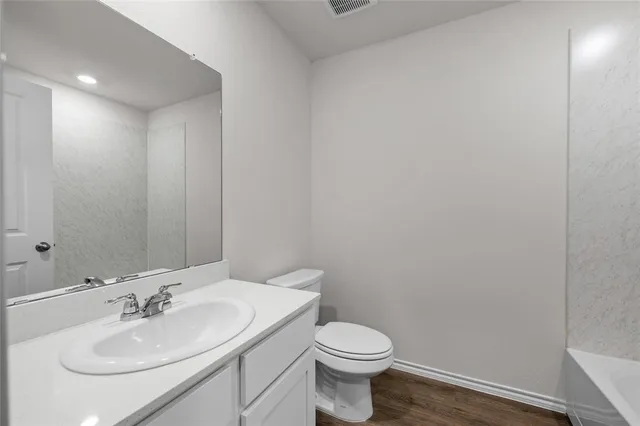 a bathroom with a sink and a toilet