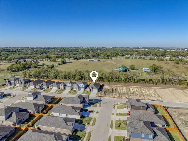 an aerial view of a houses with outdoor space