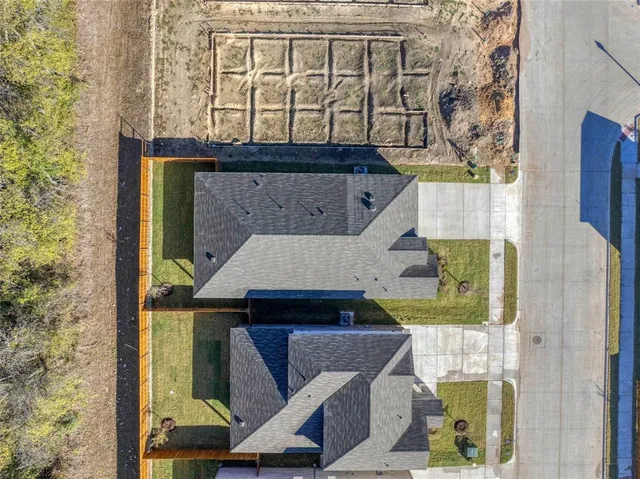 aerial view of a house with a garden