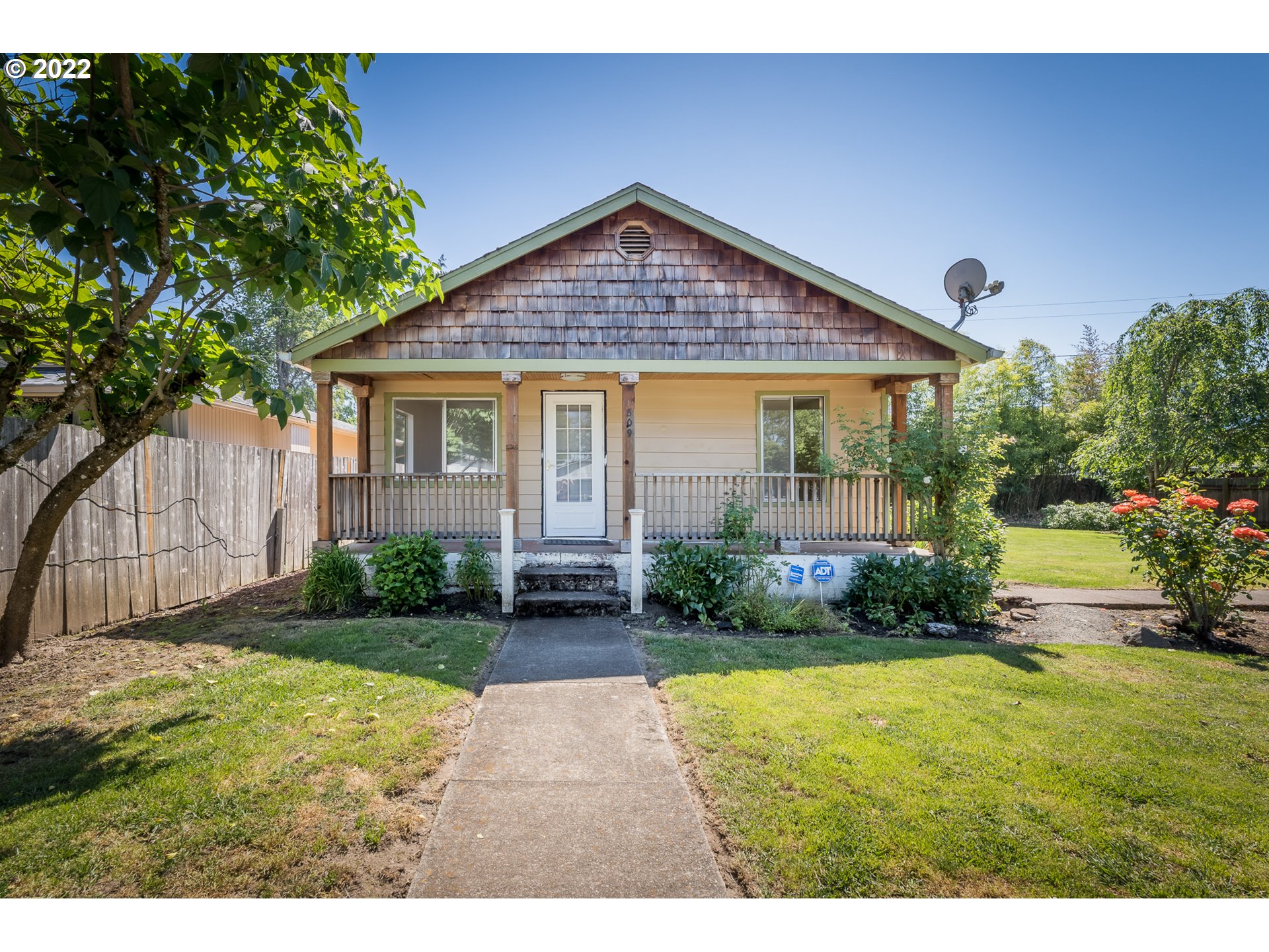 809 60th Street Springfield, OR 97478 - Photo 1 of 17 a view of a house with backyard and garden