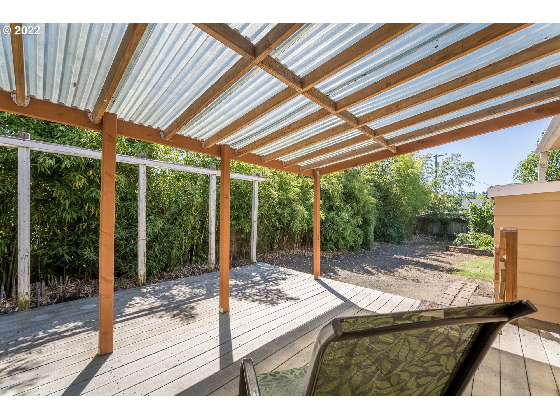 809 60th Street Springfield, OR 97478 - Photo 12 of 17 a view of a porch with furniture and garden
