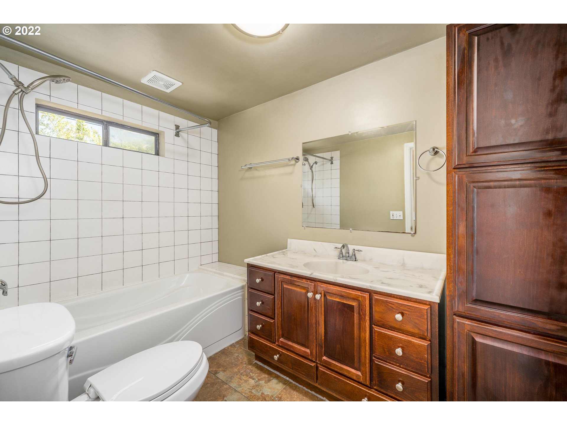 809 60th Street Springfield, OR 97478 - Photo 10 of 17 a bathroom with a granite countertop sink toilet and shower