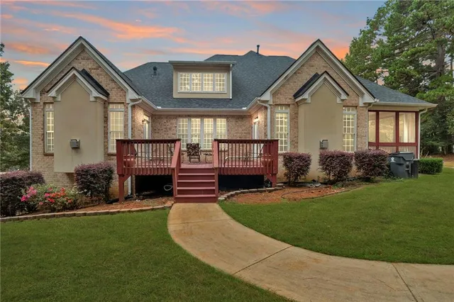 a front view of a house with garden