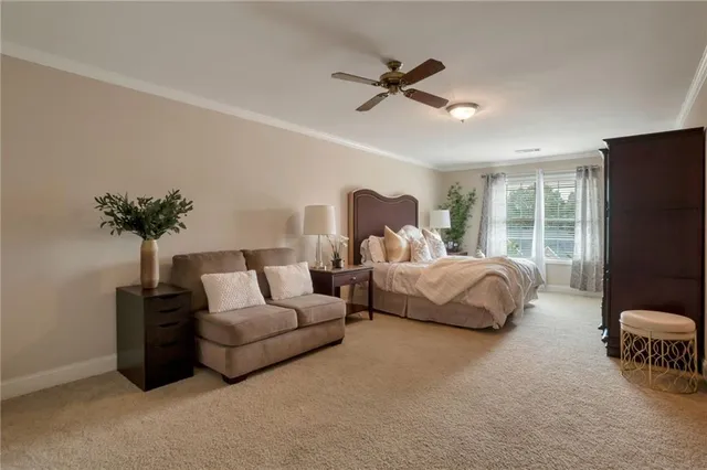 a bedroom with a bed and a lamp