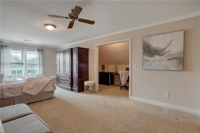 a view of workspace with a computer on a desk and chair