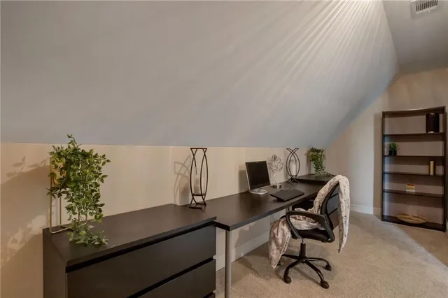 a bathroom with a toilet sink and a mirror
