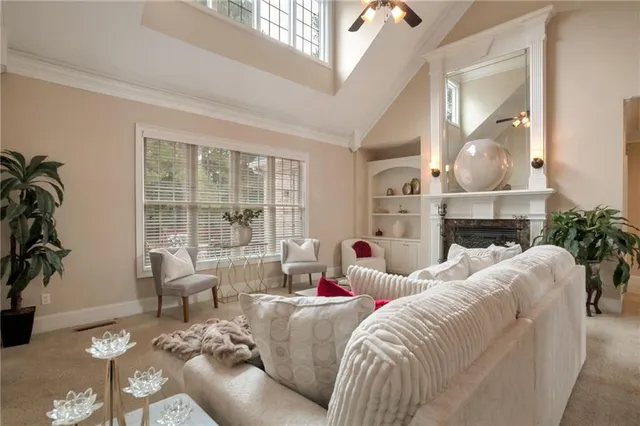 a living room with furniture and a fireplace