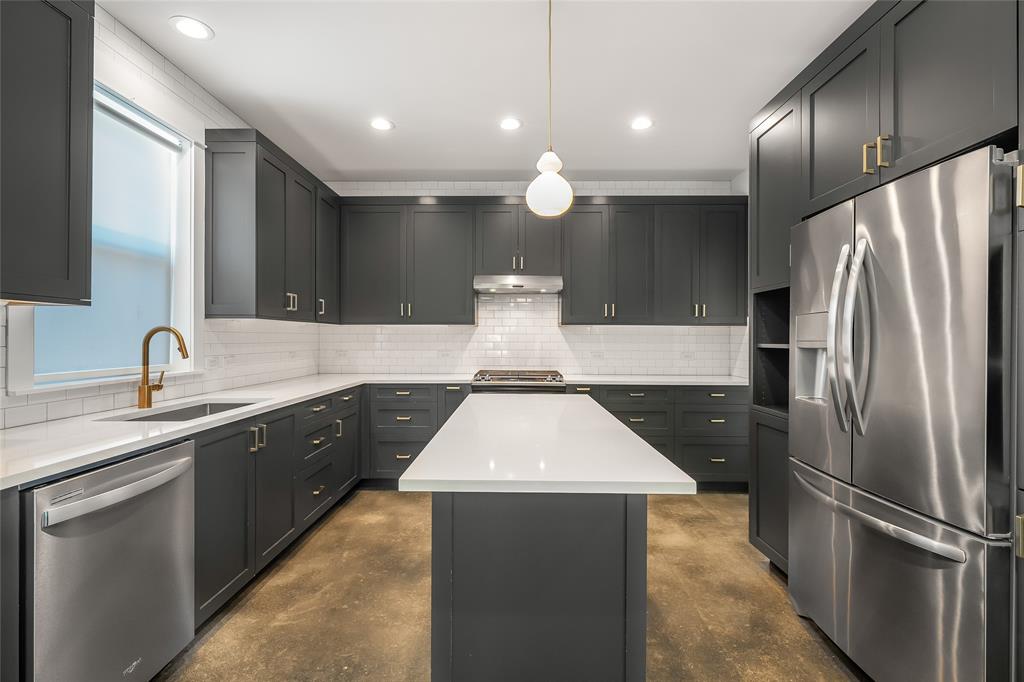 2821 Castro Street, Unit 1 Austin, TX 78702 - Photo 8 of 21 Kitchen featuring dark gray cabinetry, white countertops, stainless steel appliances, a center island, and recessed lighting
