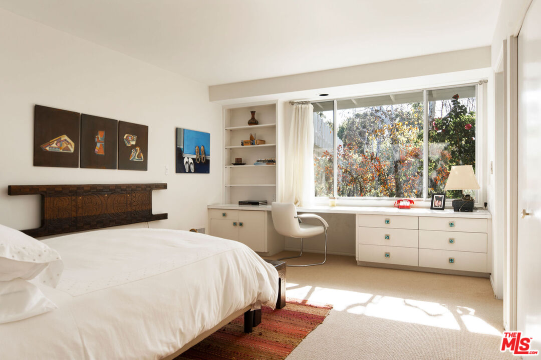 1023 Maybrook Drive Beverly Hills, CA 90210 - Photo 17 of 17 a bedroom with a bed and a large window