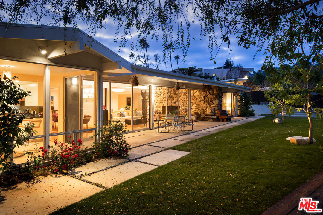 1023 Maybrook Drive Beverly Hills, CA 90210 - Photo 2 of 17 a swimming pool with outdoor seating and yard