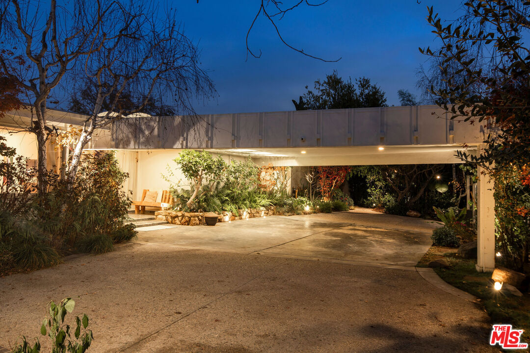 1023 Maybrook Drive Beverly Hills, CA 90210 - Photo 3 of 17 a view of a street with potted plants