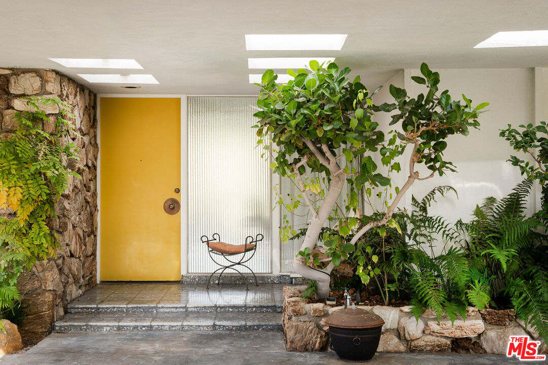 1023 Maybrook Drive Beverly Hills, CA 90210 - Photo 7 of 17 a potted plant sitting in front of a house