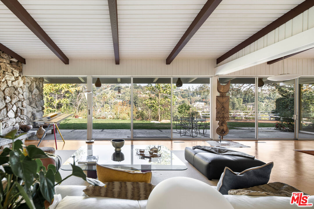1023 Maybrook Drive Beverly Hills, CA 90210 - Photo 9 of 17 a living room with furniture and a large window