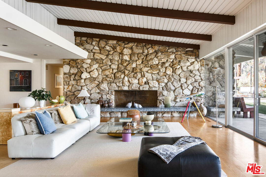 1023 Maybrook Drive Beverly Hills, CA 90210 - Photo 10 of 17 a living room with furniture and a fireplace