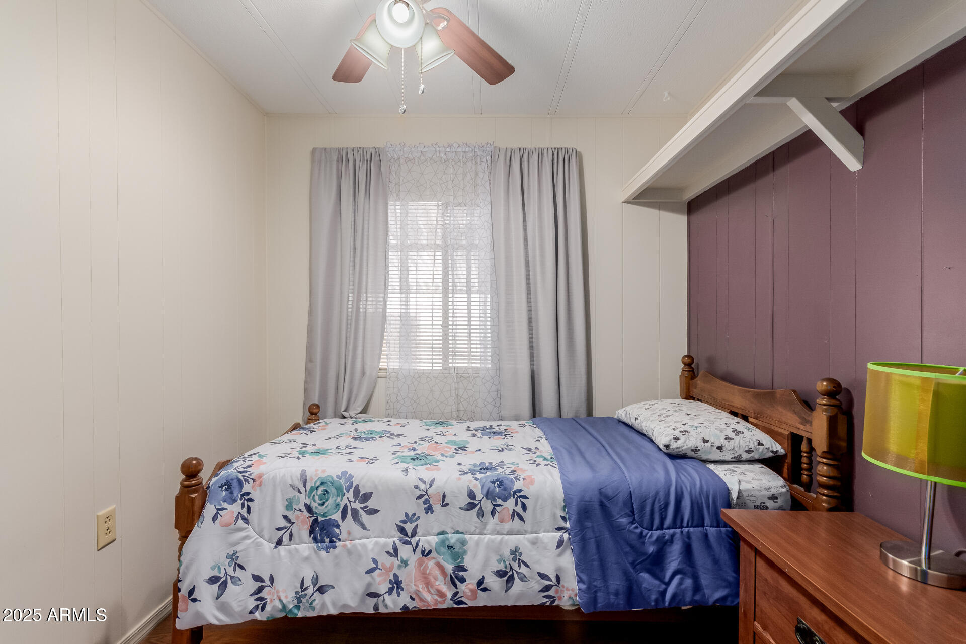1050 East Broadway Avenue, Unit 84 Apache Junction, AZ 85119 - Photo 11 of 34 a bedroom with a bed and a dresser next to a window