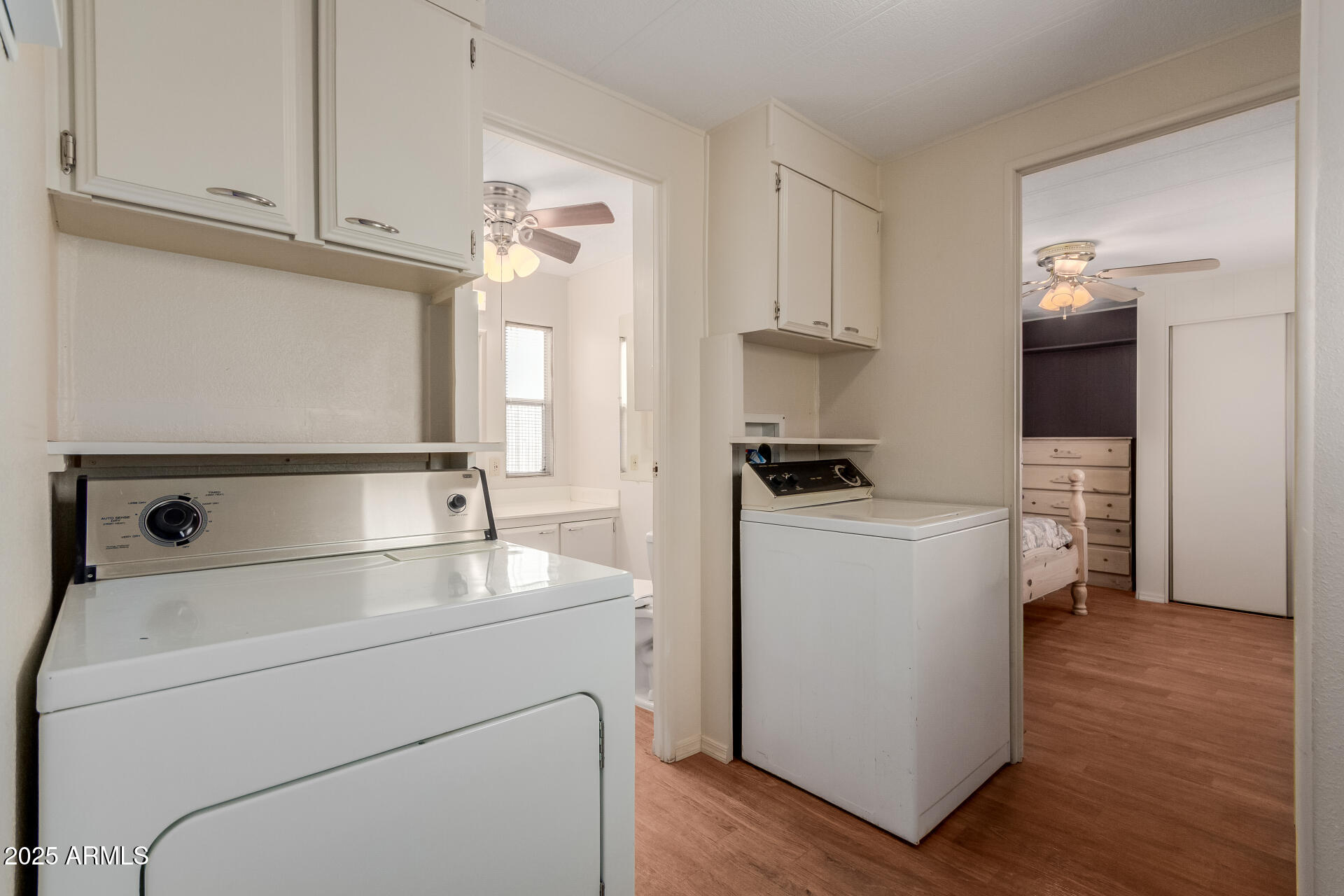 1050 East Broadway Avenue, Unit 84 Apache Junction, AZ 85119 - Photo 17 of 34 a utility room with closet dryer and washer