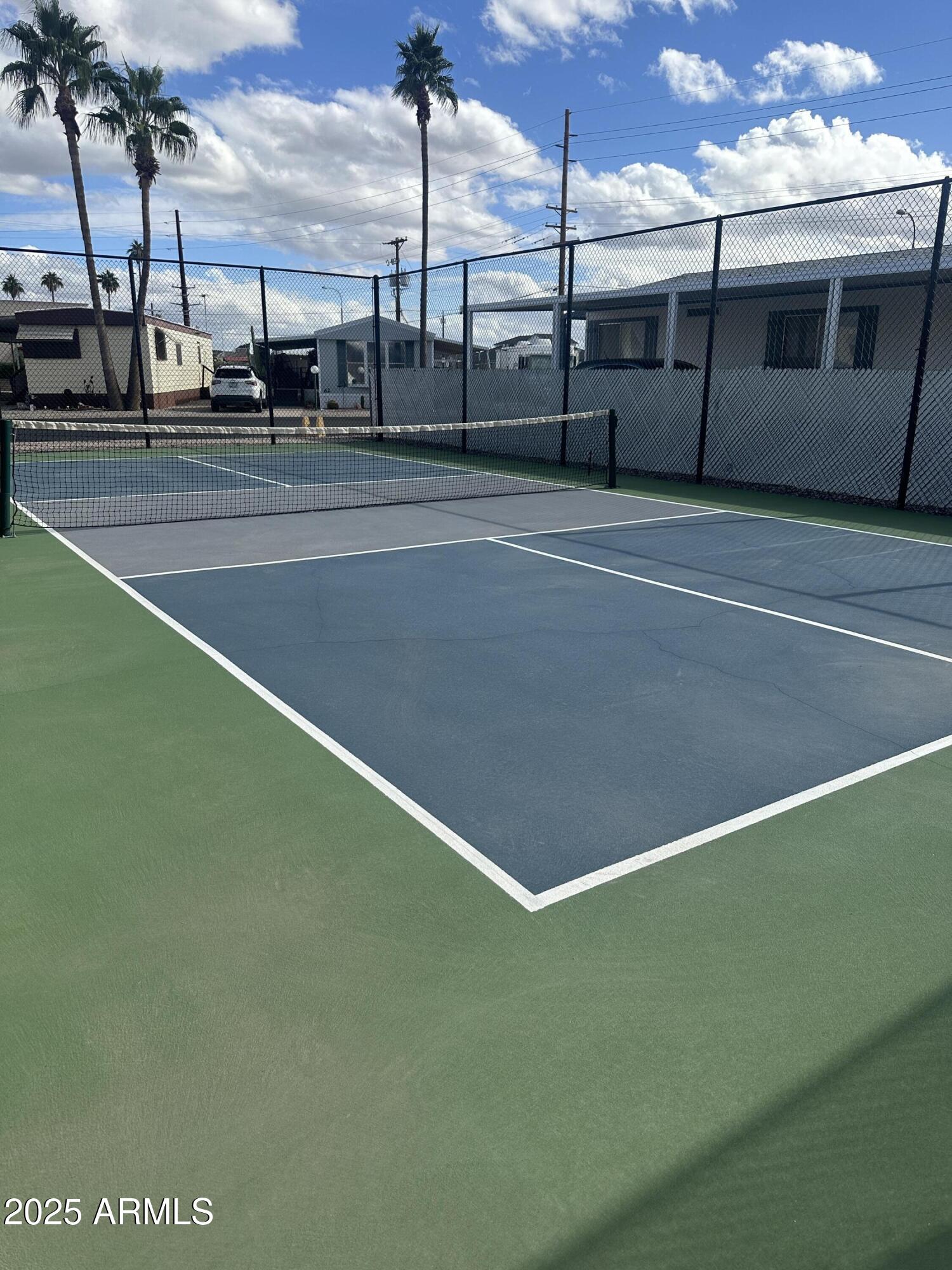 1050 East Broadway Avenue, Unit 84 Apache Junction, AZ 85119 - Photo 23 of 34 a view of a tennis court