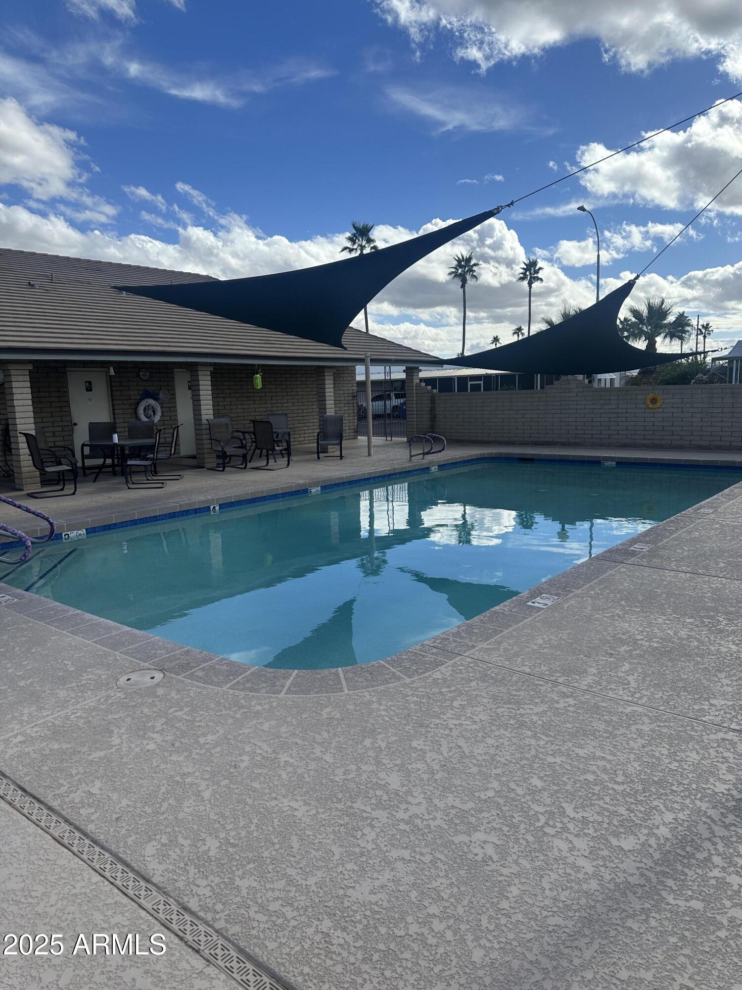 1050 East Broadway Avenue, Unit 84 Apache Junction, AZ 85119 - Photo 27 of 34 a view of building with yard