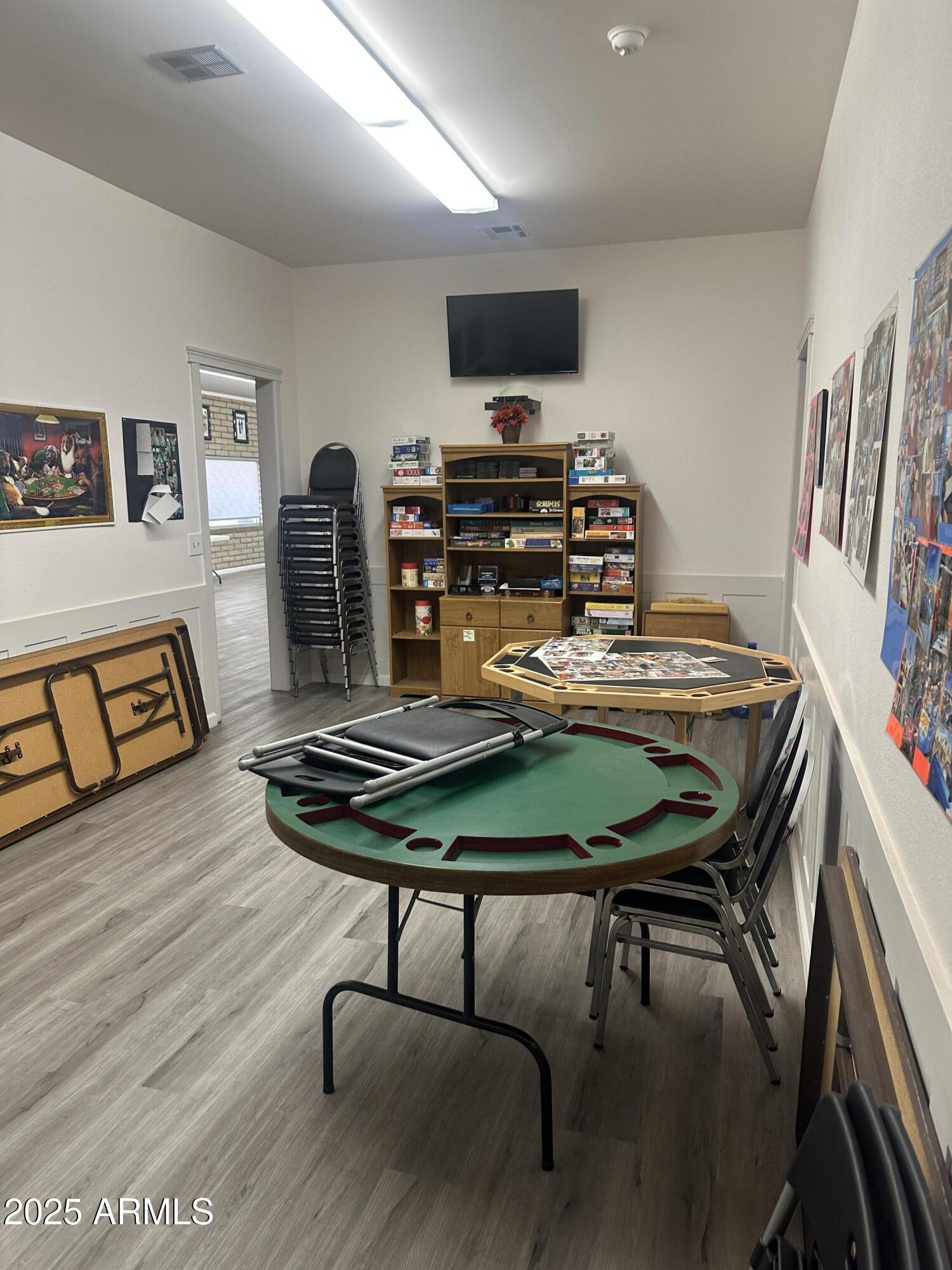 1050 East Broadway Avenue, Unit 84 Apache Junction, AZ 85119 - Photo 31 of 34 a dining room with furniture and wooden floor